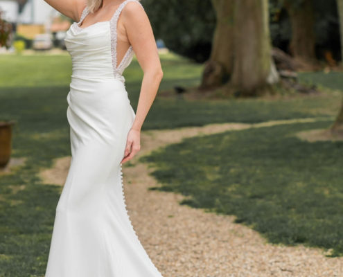 Fit and flare crepe wedding dress with pearl detail