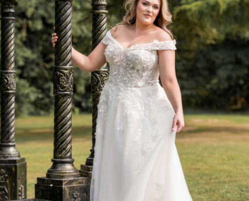 Curve wedding dress in tulle with floral detail and off the shoulder