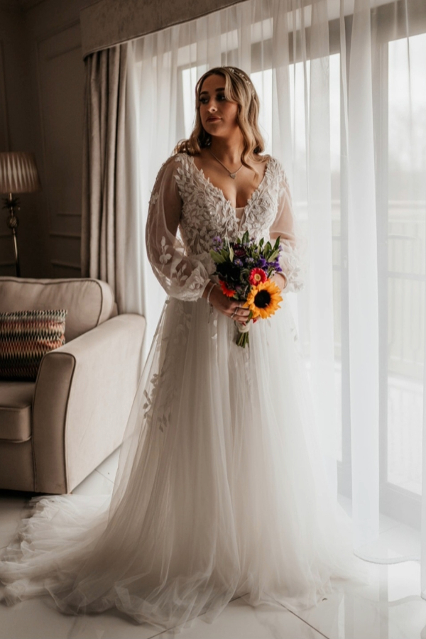 Boho style wedding dress with botanical lace details. lightweight, long sleeve.