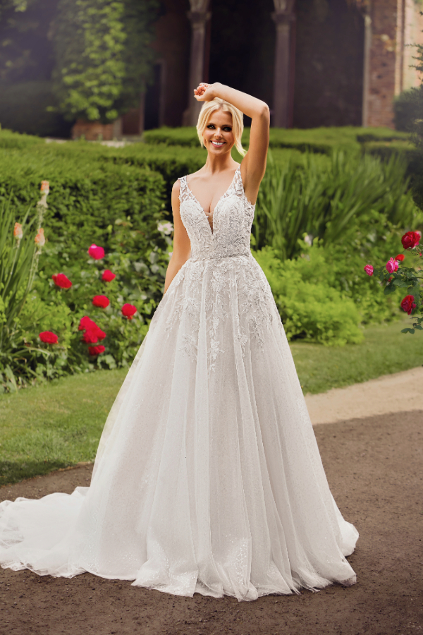 Floral, A-line wedding dress with sparkle underlayer by Phoenix Gowns