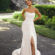 Fit and flare wedding dress in ivory. Strapless with beaded neckline and front split