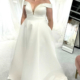 Curve range satin wedding dress with deep plunge neckline and over the shoulder sleeve