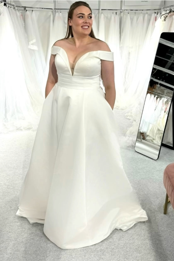 Curve range satin wedding dress with deep plunge neckline and over the shoulder sleeve