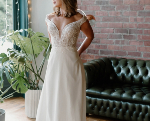 ivory wedding dress with lace bodice and chiffon skirt