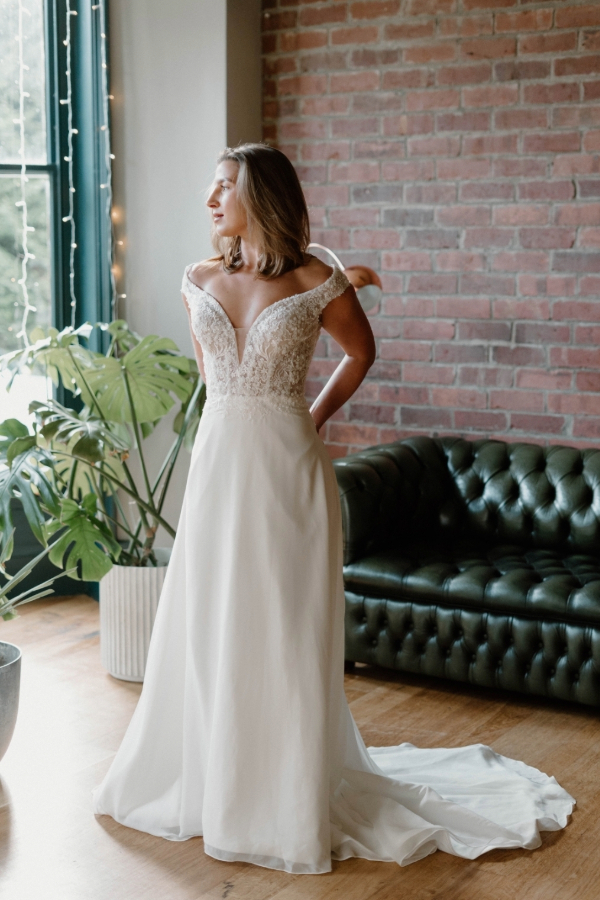 ivory wedding dress with lace bodice and chiffon skirt