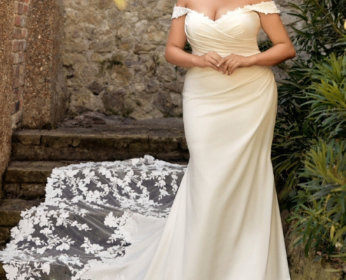 Ivory, fit and flare dress in crepe with lace train and off the shoulder detail