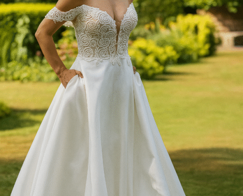 A-line wedding dress with beaded bodice and satin skirt. off the shoulder.
