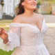 Curve wedding dress with all over floral lace and off the shoulder detail. Detachable sleeves available