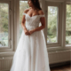 Off the shoulder wedding dress with floral lace applique and sparkling layers