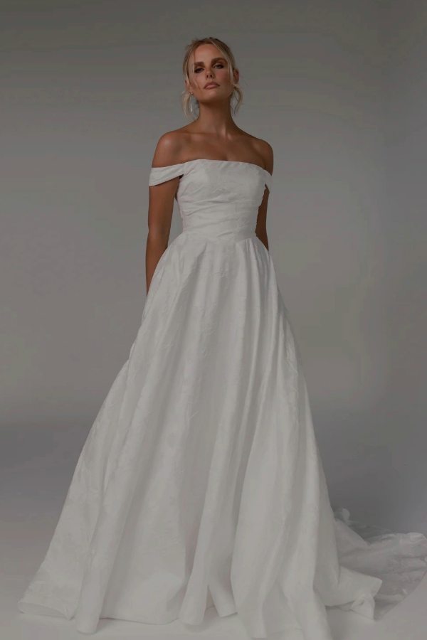 Textured Satin wedding dress with off the shoulder sleeves by Tania Olsen