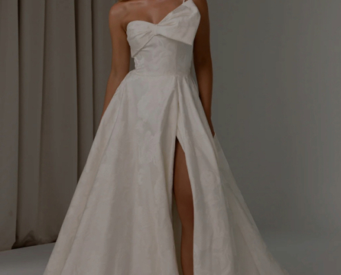 Jacquard satin wedding dress with statement bow and one shoulder by Tania Olsen