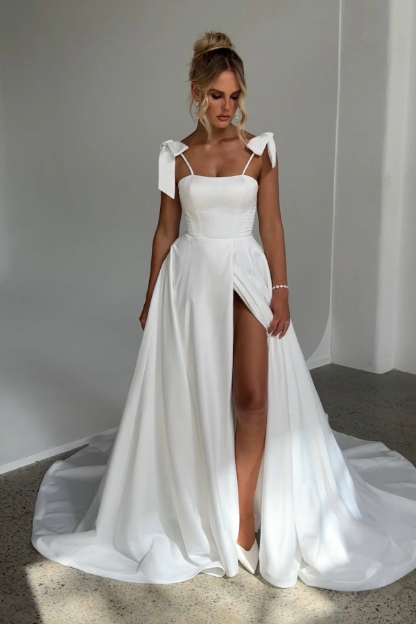 Satin Wedding dress with detachable bow straps and front leg split in Ivory by Tania Olsen