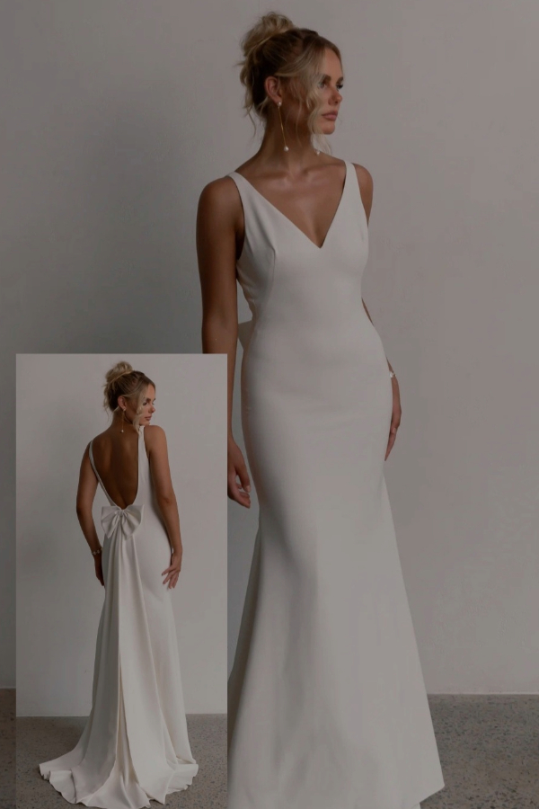 Fitted , mermaid style wedding dress with large bow by Tania Olsen