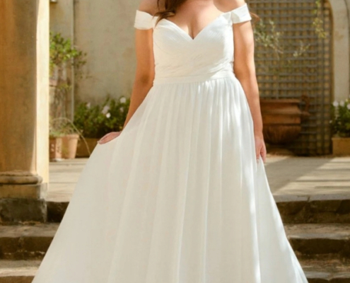 Flowing chiffon wedding dress with pleated bodice