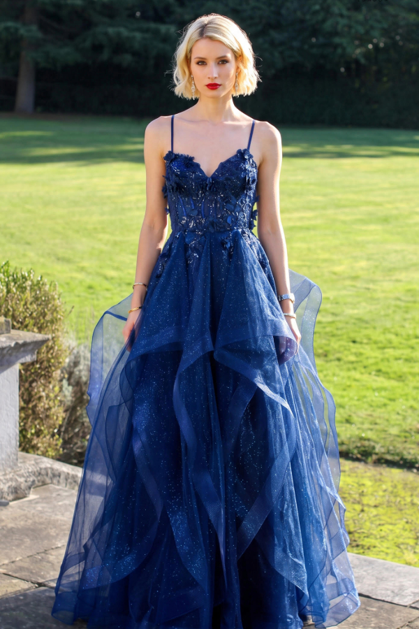 Layered prom dress with glitter and 3d flowers and a lace up bodice